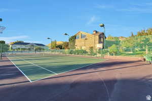 View of tennis court featuring community basketball court