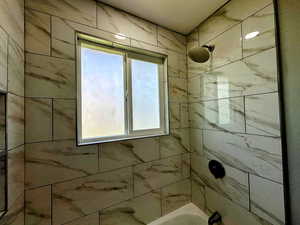 Full bathroom with shower / washtub combination