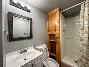 Bathroom with a stall shower and vanity