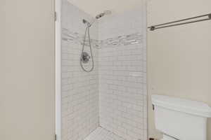 Bathroom with toilet and a shower stall