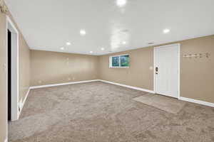 Spare room with light carpet and recessed lighting