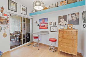 Dining area with light wood-style floors