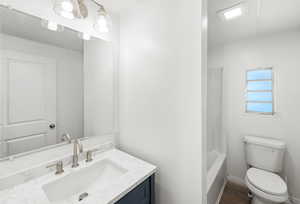 Full bath featuring vanity and shower / bath combination