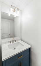 Bathroom with vanity and a textured ceiling