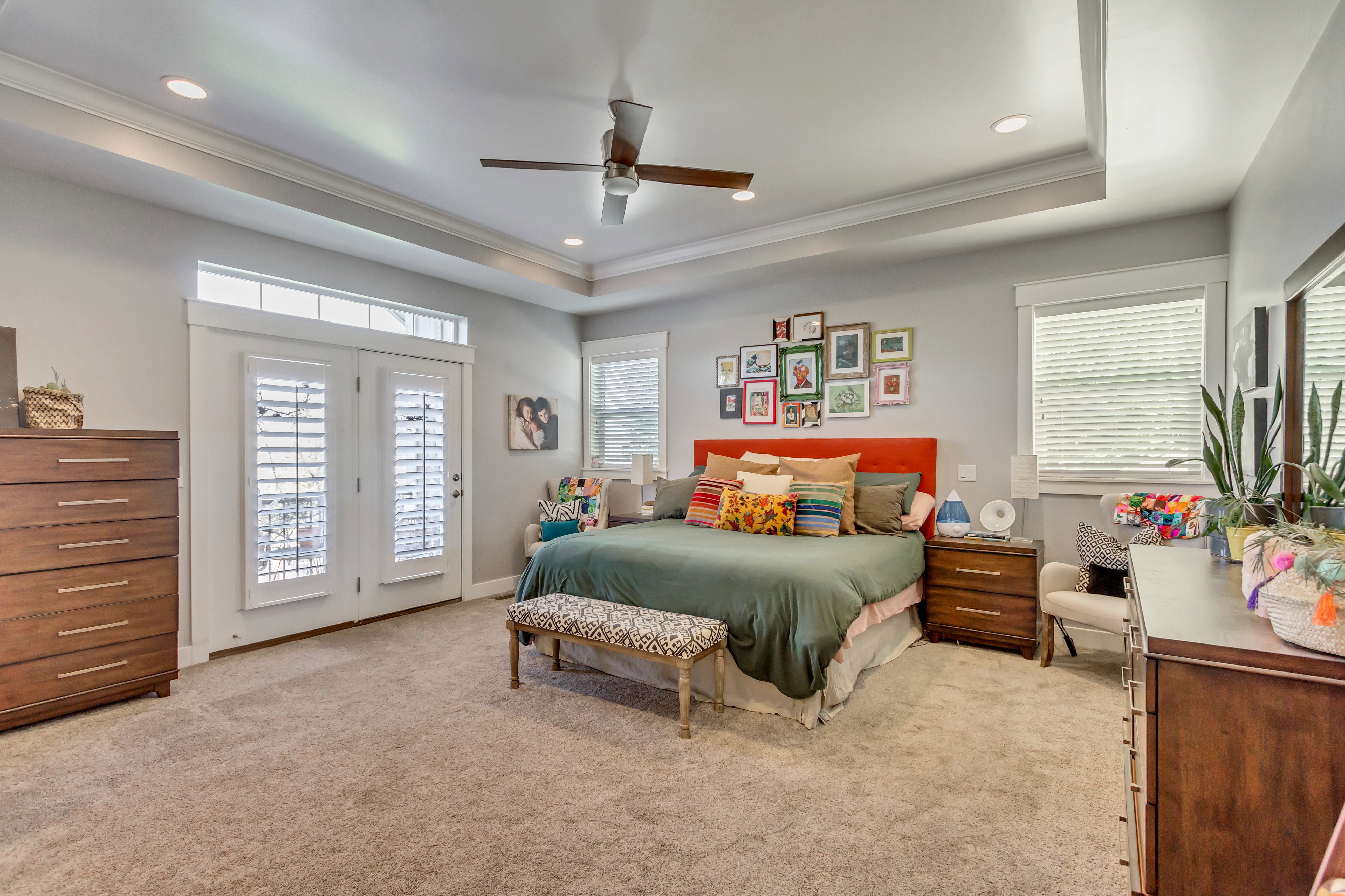 Bedroom with access to outside, multiple windows, light carpet, recessed lighting, and crown molding