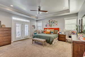 Bedroom with access to outside, multiple windows, light carpet, recessed lighting, and crown molding
