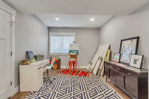 Rec room featuring light wood finished floors and recessed lighting