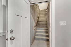 Staircase with unfinished concrete floors