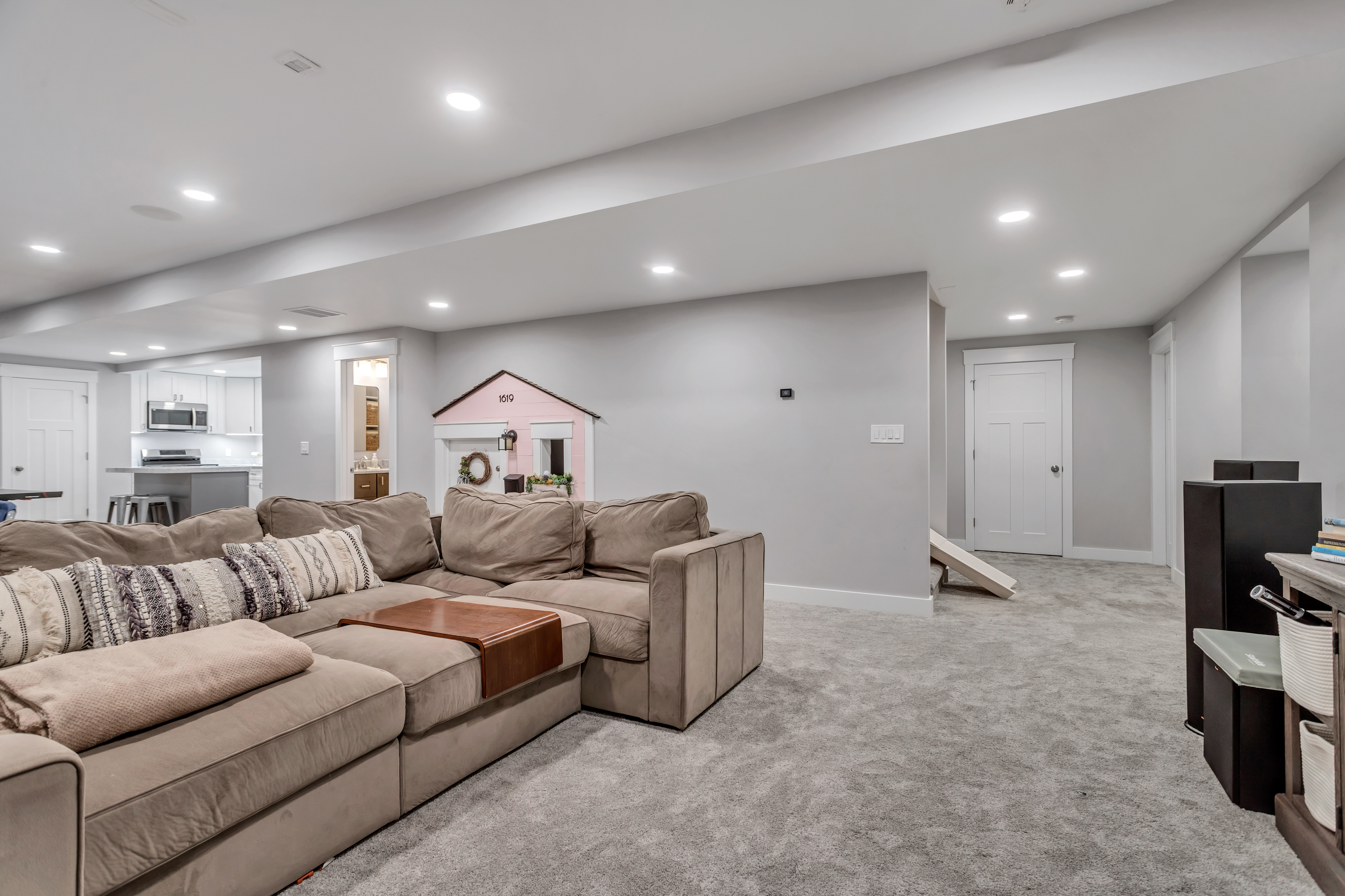 Living area featuring recessed lighting and light carpet