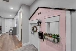 Corridor featuring recessed lighting and dark wood-type flooring