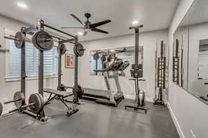 Workout room with rubber floors and recessed lighting