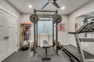Exercise area featuring recessed lighting and a ceiling fan
