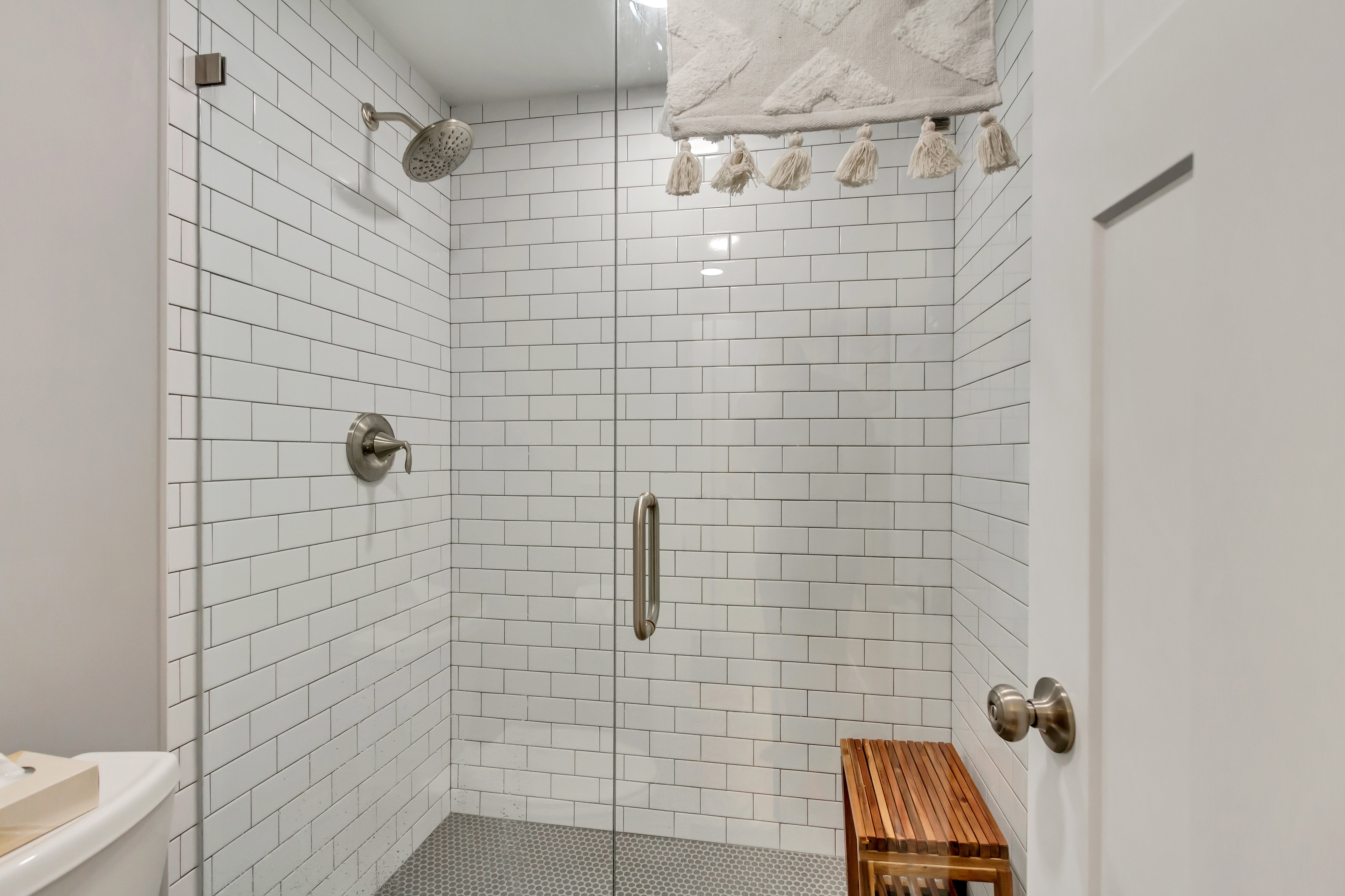 Full bath with a stall shower and toilet