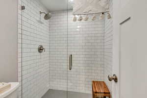Full bath with a stall shower and toilet