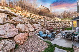 View of yard with a patio and outdoor dining area