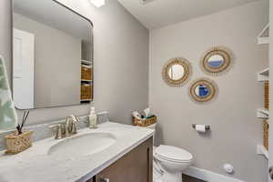 Bathroom with vanity and toilet