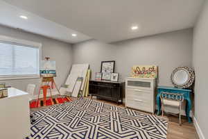 Rec room featuring light wood-type flooring and recessed lighting
