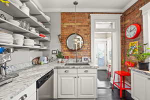 Kitchen with open shelves, stainless steel dishwasher, dark wood-style floors, white cabinets, and ornamental molding