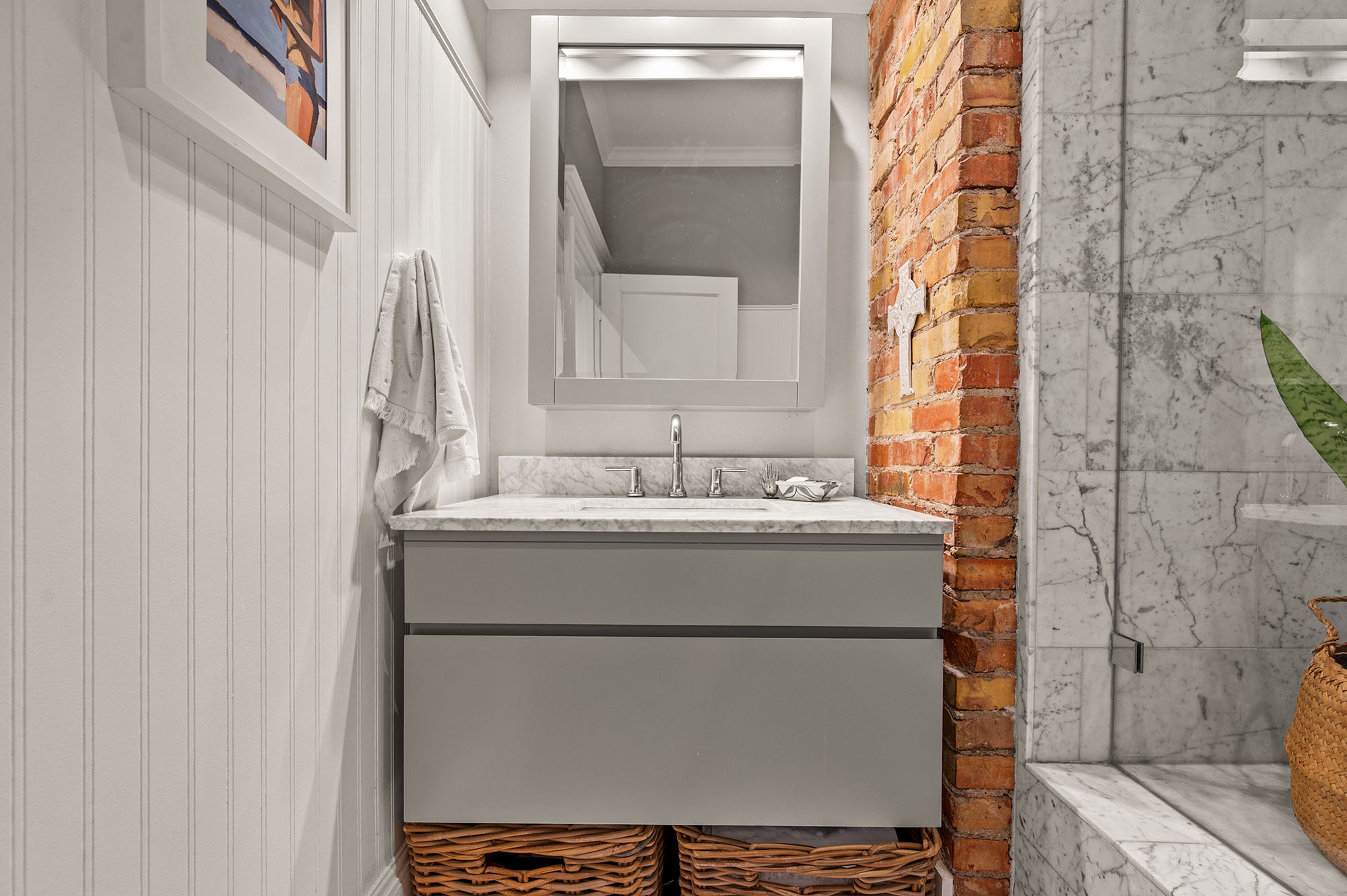 Bathroom featuring ornamental molding and vanity
