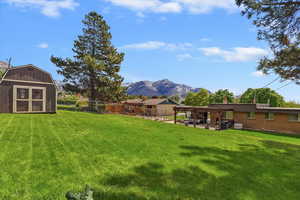 Fenced backyard with large shed