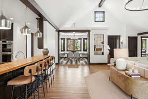 Living room featuring a chandelier and light wood finished floors