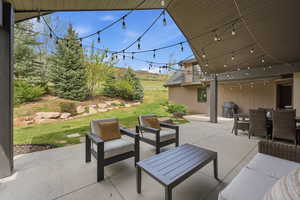 View of patio / terrace with grilling area and an outdoor living / dining area