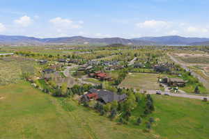 Aerial view of residential area featuring a mountain backdrop