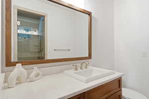 Full bath featuring vanity and a stall shower