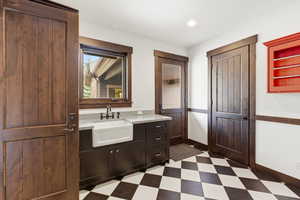 Bathroom with vanity and dark floors