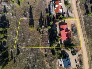 Aerial view of property and surrounding area with property boundaries highlighted