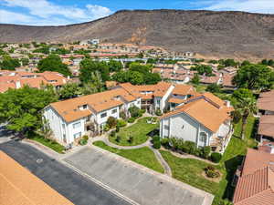 Aerial perspective of suburban area with a mountain backdrop