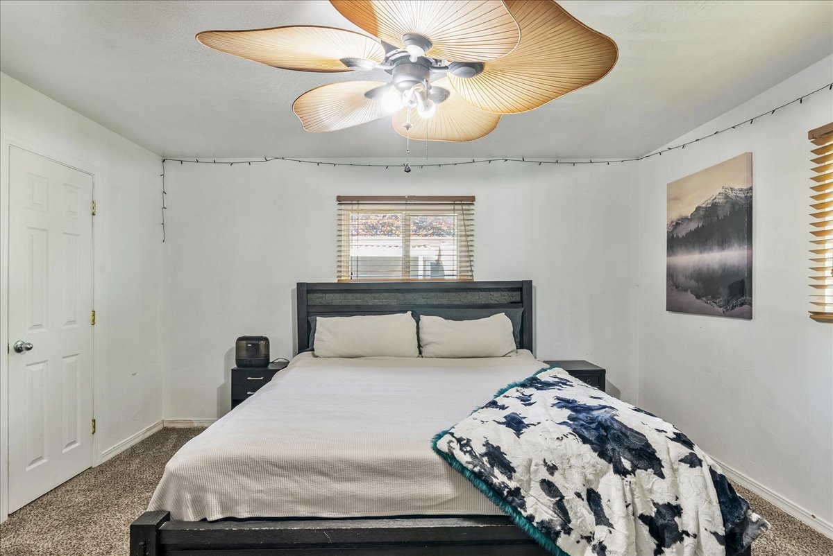 Bedroom featuring carpet floors and a ceiling fan