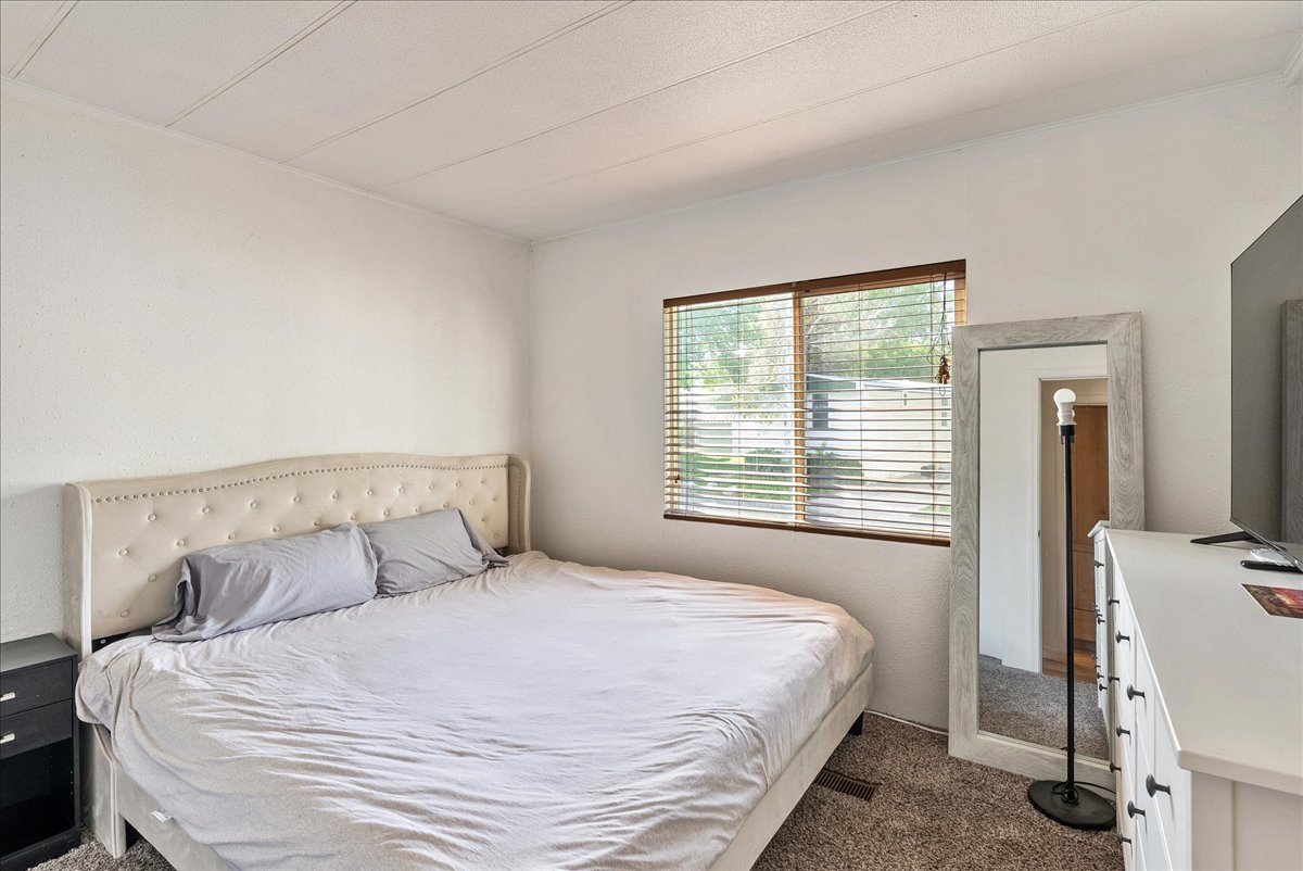 Bedroom with dark carpet