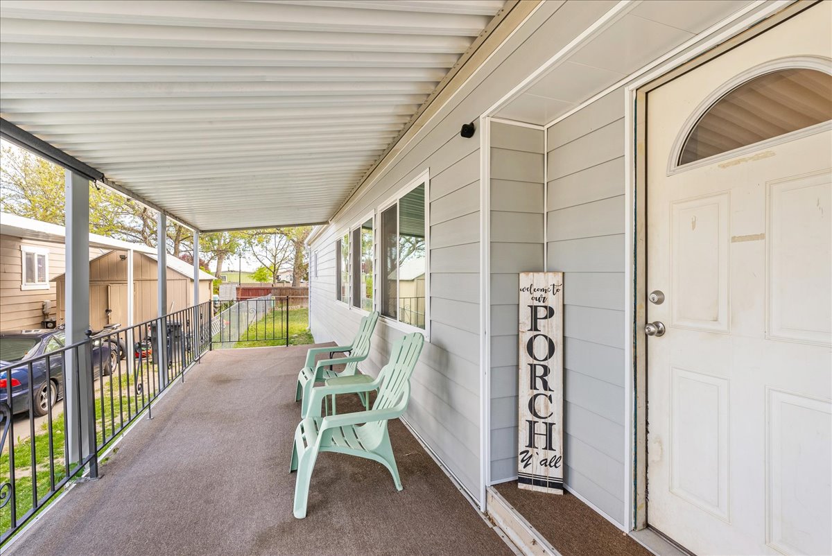 Porch featuring a shed