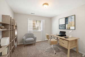 Office space with carpet flooring and baseboards