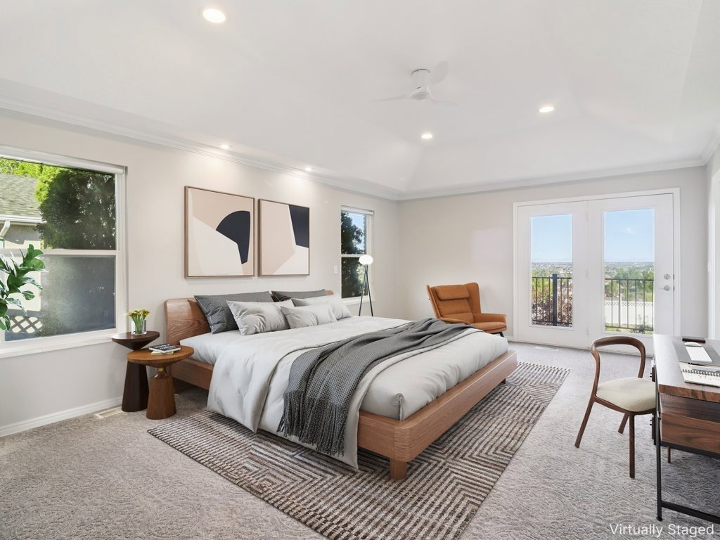 Carpeted bedroom featuring access to exterior, ceiling fan, recessed lighting, a raised ceiling, and ornamental molding