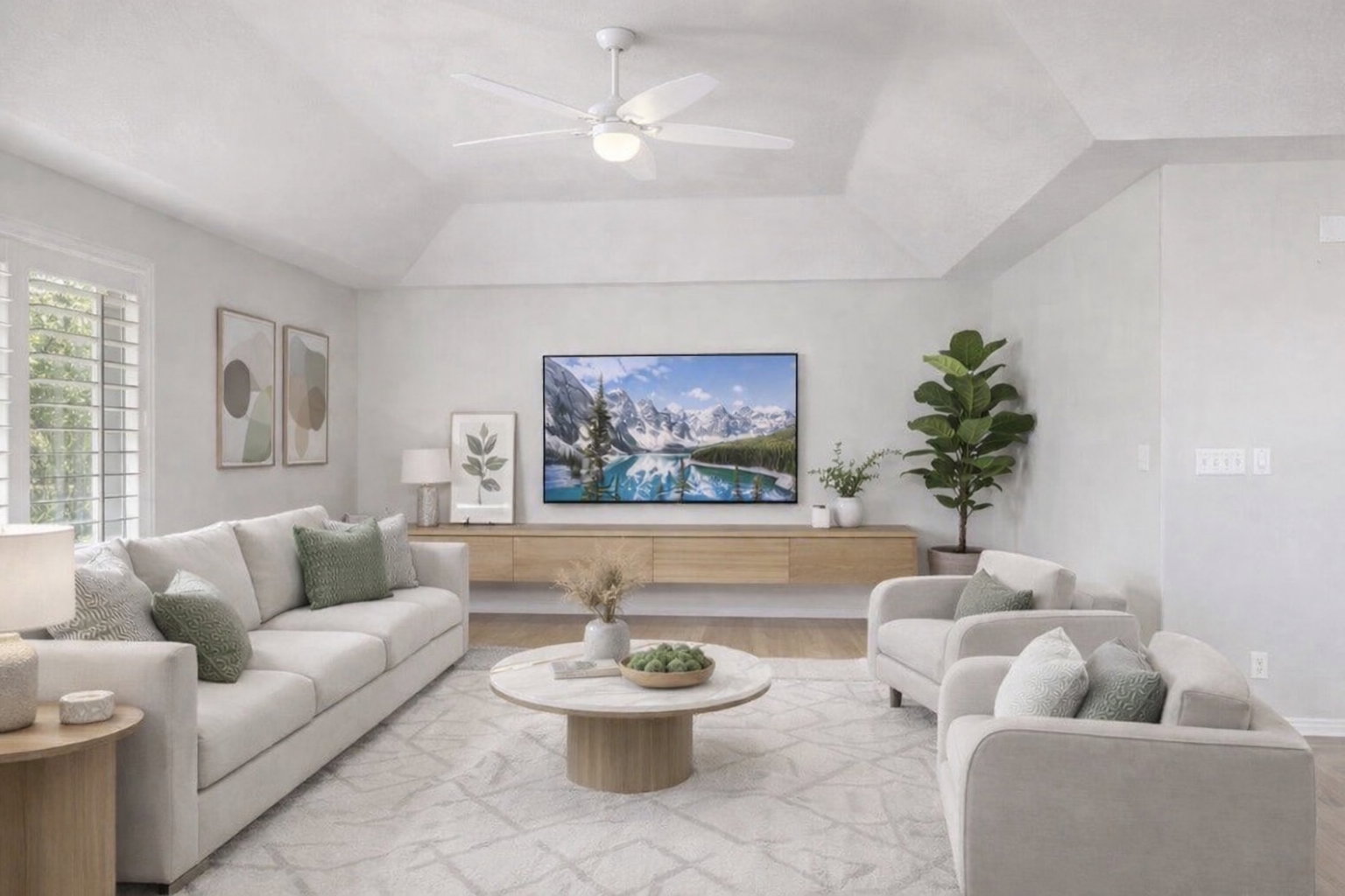 Living room with a ceiling fan and wood finished floors