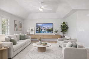 Living room with a ceiling fan and wood finished floors