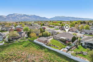 Aerial perspective of suburban area featuring a mountain backdrop