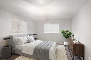 Bedroom featuring carpet flooring and a textured ceiling