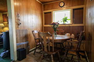 Dining room with wooden walls
