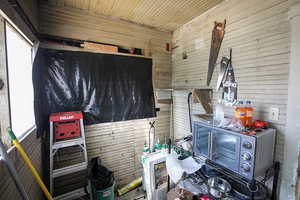 Misc room with wooden walls