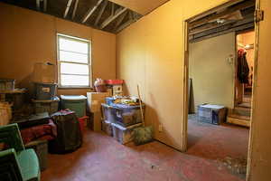 Miscellaneous room featuring unfinished concrete floors