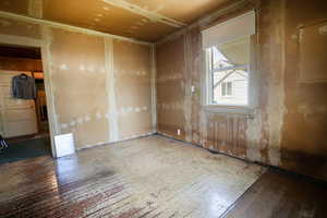 Spare room featuring wood-type flooring