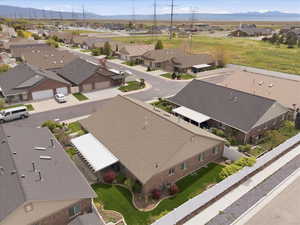 Aerial perspective of suburban area with a mountain backdrop