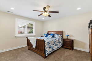 Bedroom featuring a ceiling fan, carpet flooring, and recessed lighting