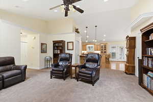 Living room with french doors, a ceiling fan, recessed lighting, light colored carpet, and vaulted ceiling