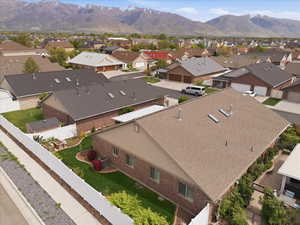 Aerial perspective of suburban area featuring a mountainous background
