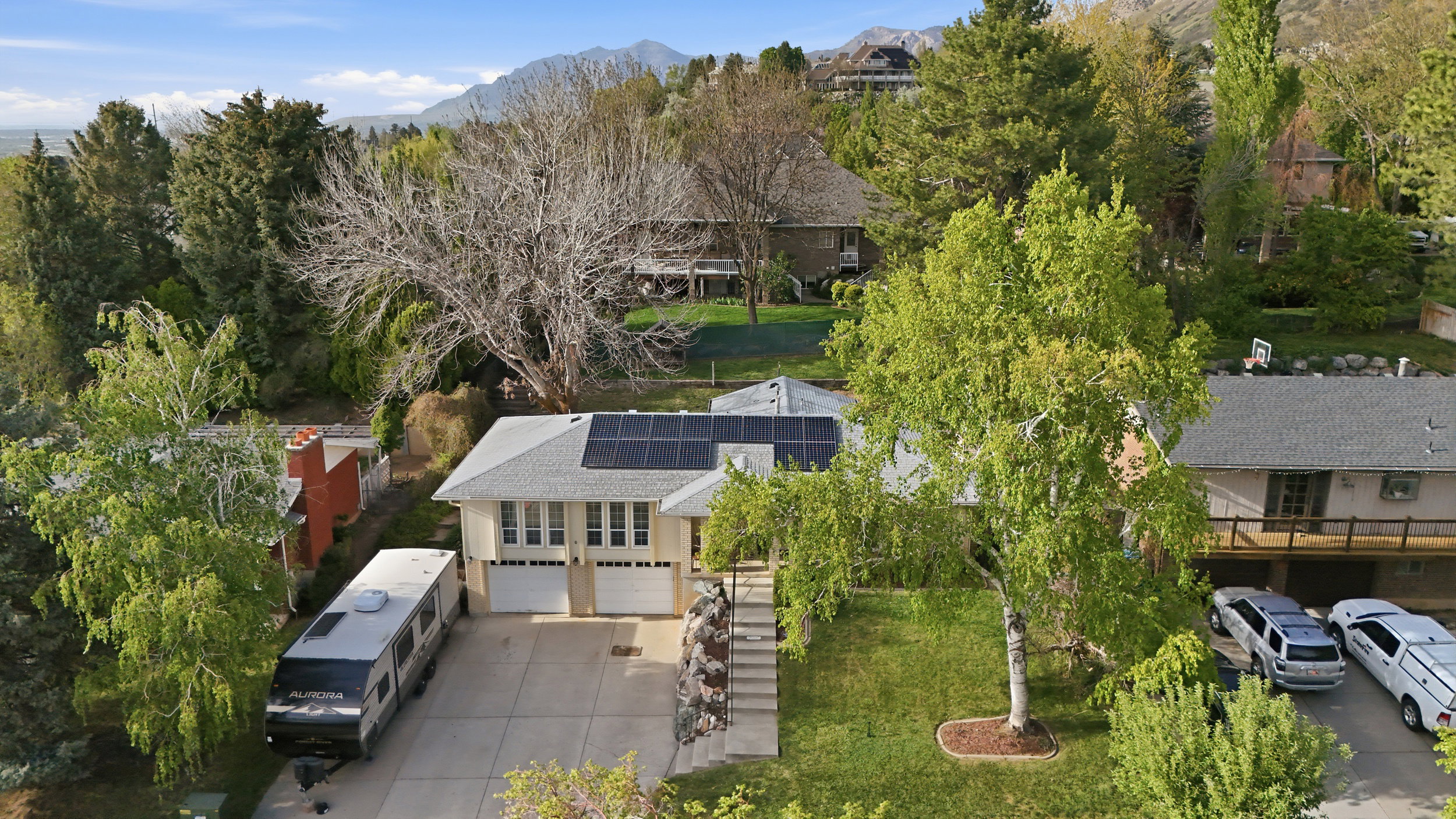 Bird's eye view of mountains and a tree filled landscape