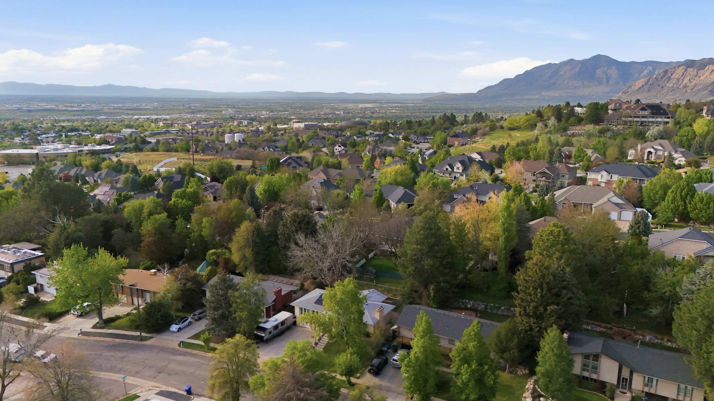 Aerial view of residential area featuring a mountainous background